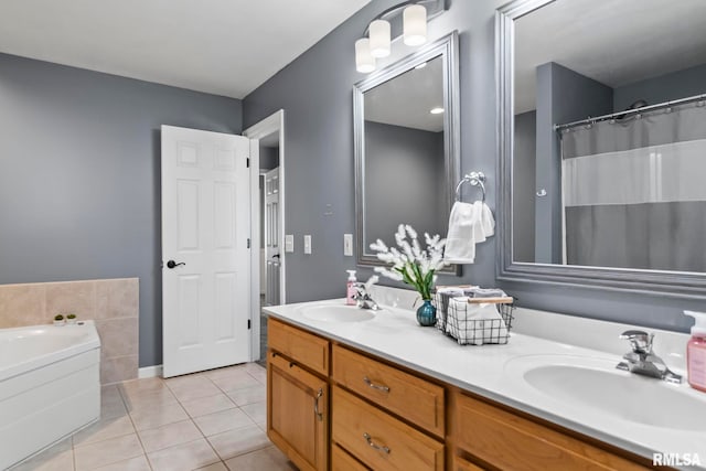 bathroom with tile patterned flooring, double vanity, a bath, and a sink