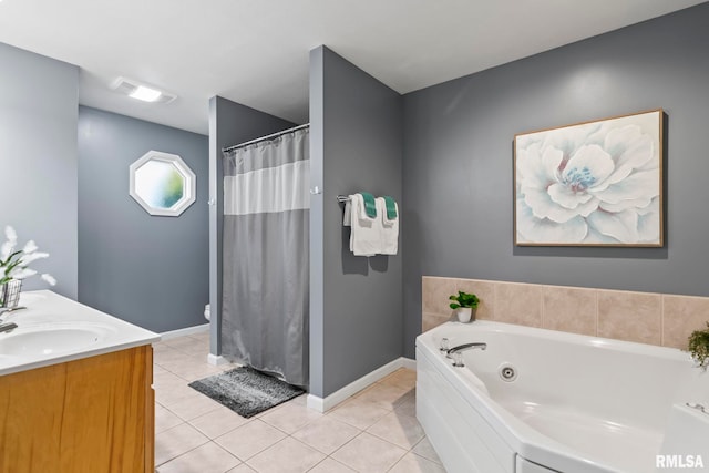 bathroom with a sink, baseboards, a whirlpool tub, and tile patterned floors