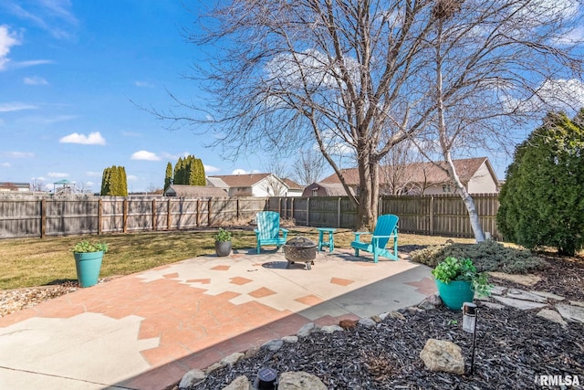 view of patio with a fire pit and a fenced backyard