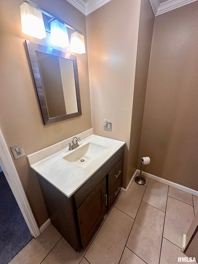 bathroom with tile patterned floors, ornamental molding, and vanity