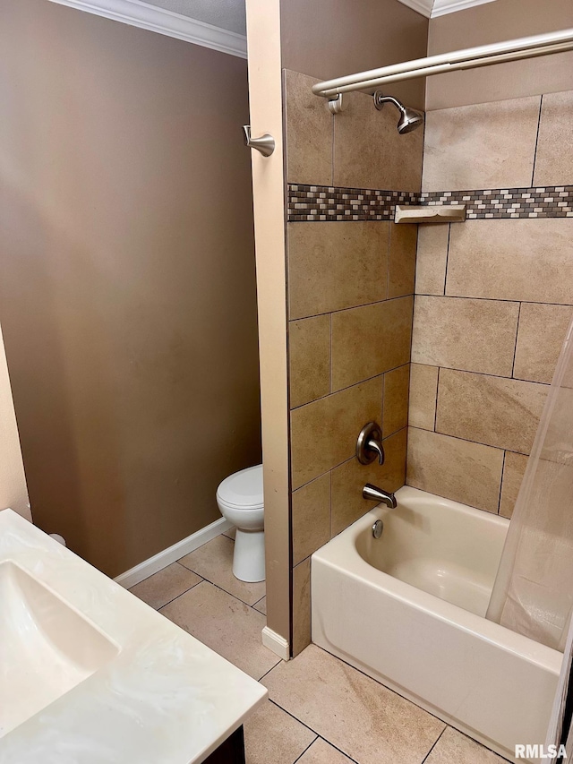 bathroom featuring toilet, crown molding, tile patterned flooring, baseboards, and bathing tub / shower combination