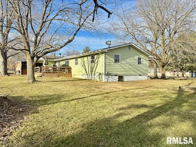 back of house with a yard