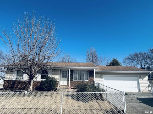 ranch-style house featuring a fenced front yard, brick siding, concrete driveway, and an attached garage