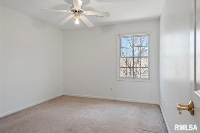 empty room featuring a ceiling fan, baseboards, and carpet floors