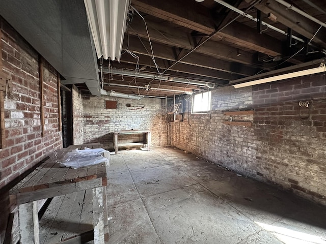 basement with brick wall