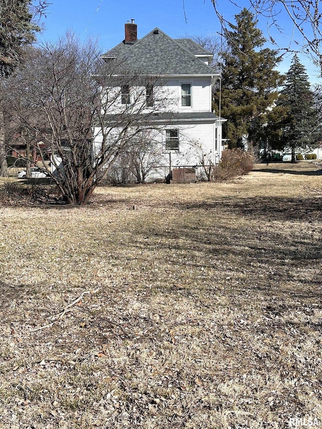 view of property exterior with a chimney