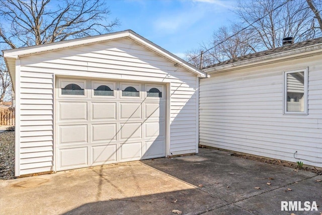 detached garage featuring driveway