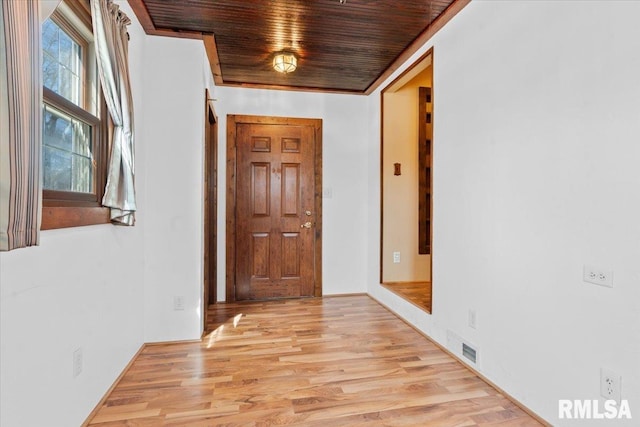 hall featuring wooden ceiling, visible vents, and light wood finished floors