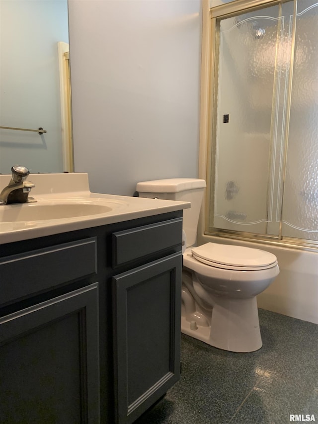 full bath featuring enclosed tub / shower combo, toilet, granite finish floor, and vanity