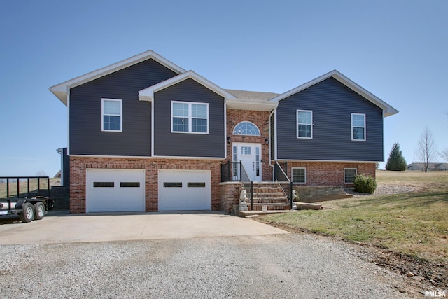 bi-level home featuring brick siding, concrete driveway, and an attached garage