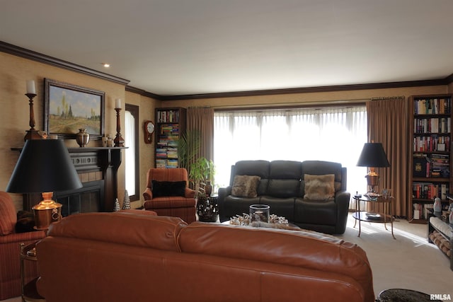 living area with a wealth of natural light, carpet, and crown molding