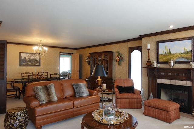 living area with a chandelier, light colored carpet, a glass covered fireplace, and ornamental molding