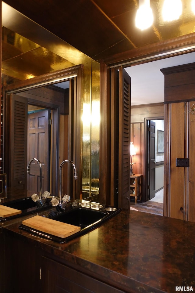 interior space with indoor wet bar and a sink