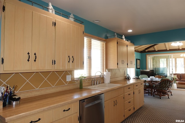 kitchen featuring carpet floors, a sink, decorative backsplash, dishwasher, and open floor plan