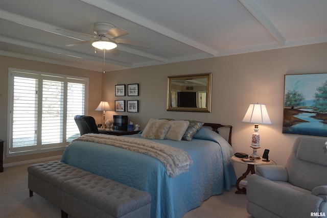 bedroom featuring beam ceiling, carpet, and ceiling fan