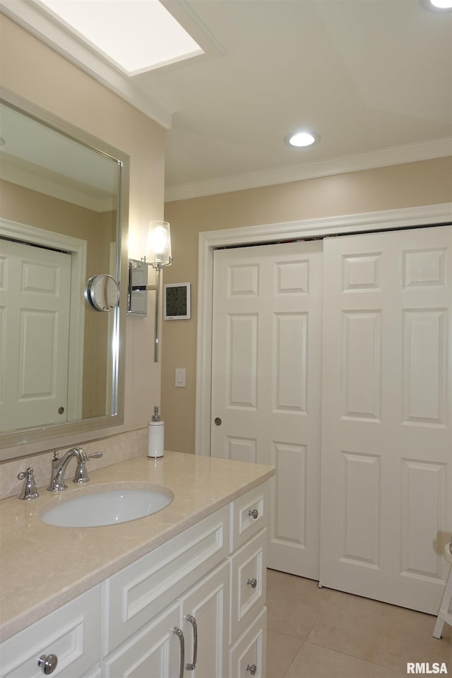 bathroom with tile patterned flooring, recessed lighting, vanity, and ornamental molding