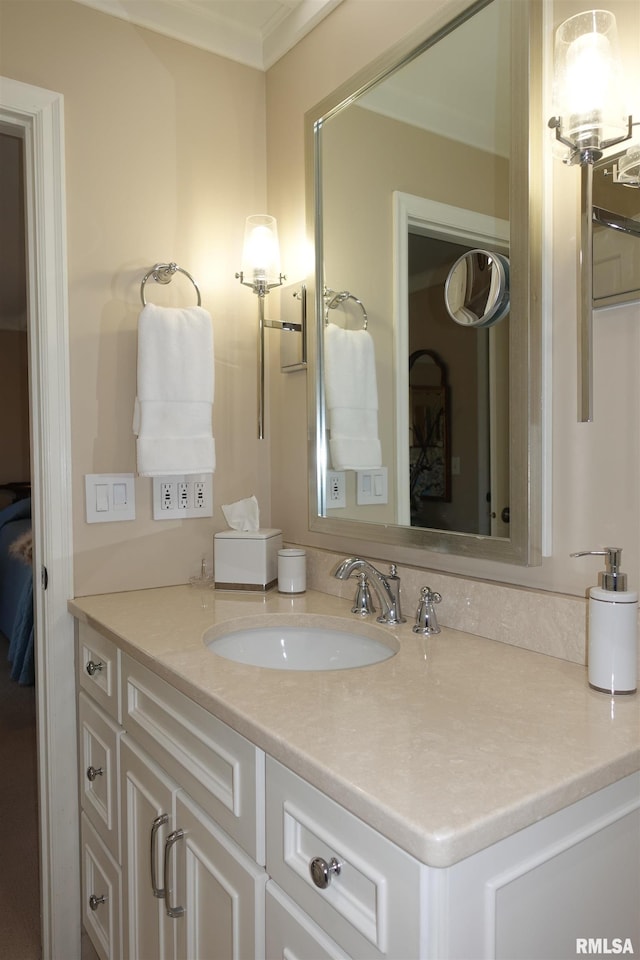 bathroom featuring vanity and crown molding