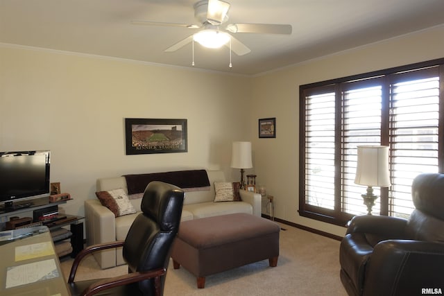 living area featuring plenty of natural light, baseboards, crown molding, and carpet