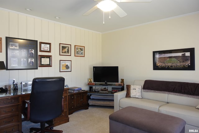 office space featuring ceiling fan, light colored carpet, and ornamental molding