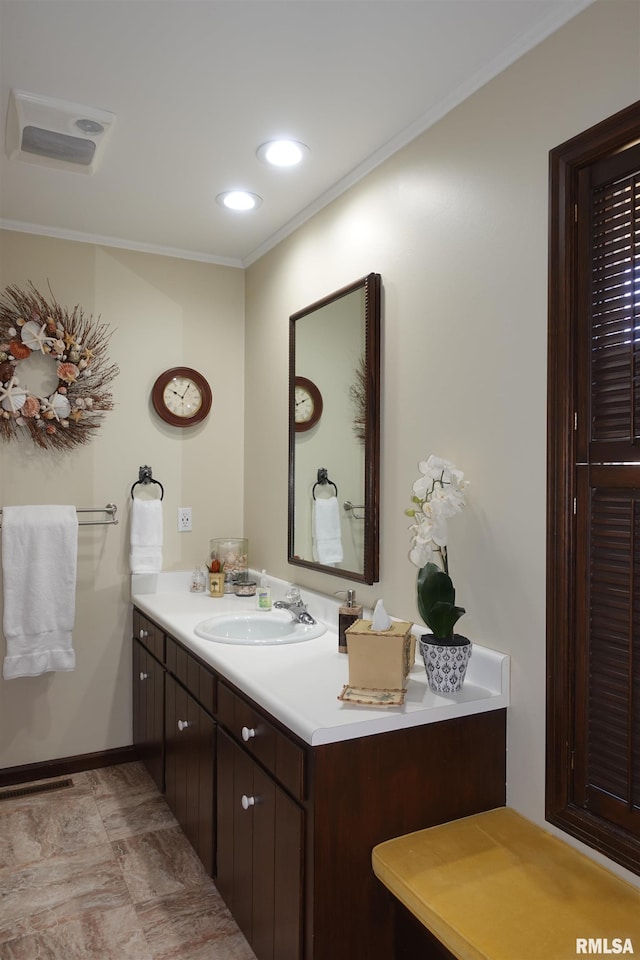 bathroom featuring visible vents, recessed lighting, crown molding, baseboards, and vanity