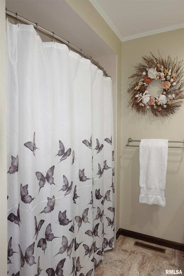 bathroom featuring visible vents, baseboards, a shower with curtain, and ornamental molding