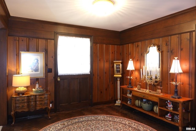 foyer entrance with wooden walls