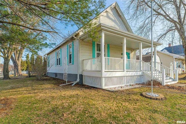 view of front of house with a porch and a front lawn