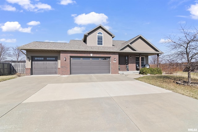 view of front of property featuring fence, driveway, a porch, a garage, and brick siding