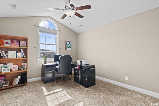 office space with visible vents, ceiling fan, baseboards, carpet, and vaulted ceiling