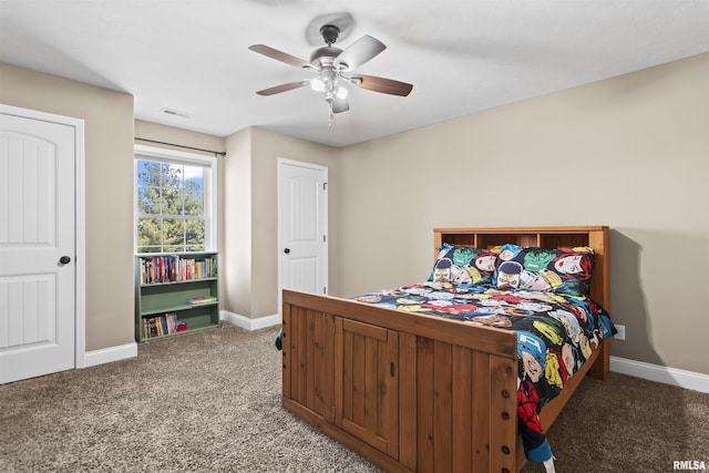 bedroom with a ceiling fan, visible vents, baseboards, and light carpet