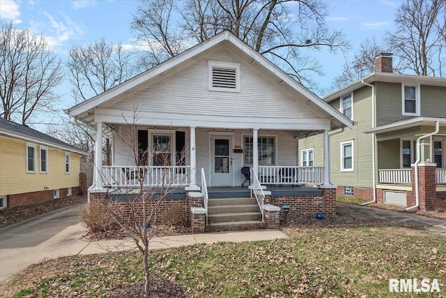 bungalow-style home featuring covered porch