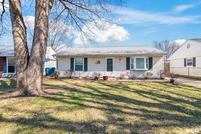 view of front of home with a front lawn and fence