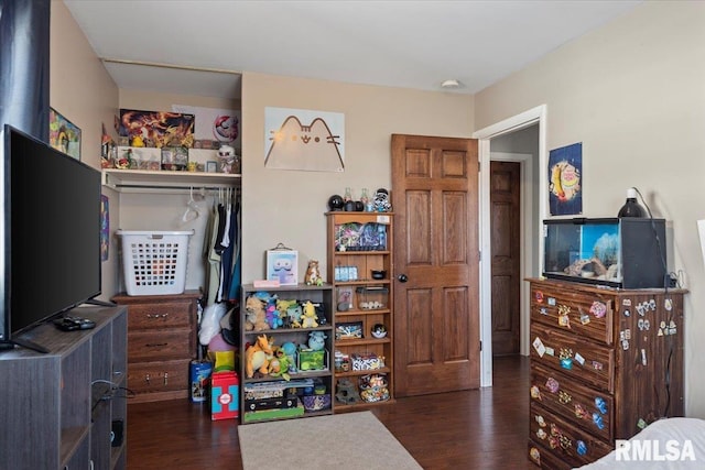 bedroom featuring wood finished floors