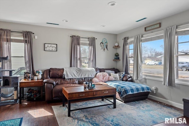 living room featuring recessed lighting, wood finished floors, visible vents, and baseboards