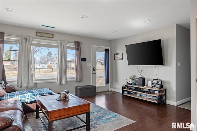 living room with recessed lighting, baseboards, a healthy amount of sunlight, and wood finished floors