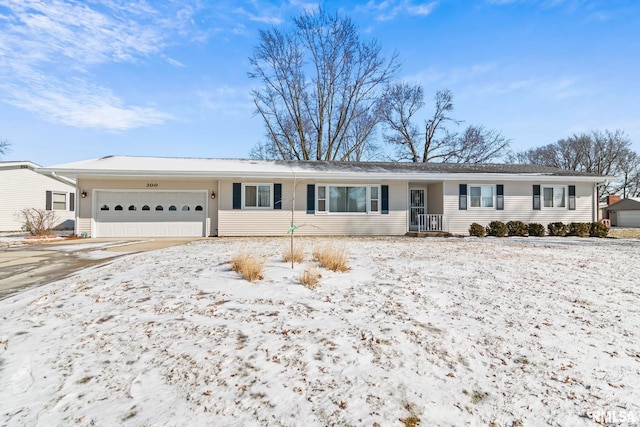 single story home featuring an attached garage and driveway