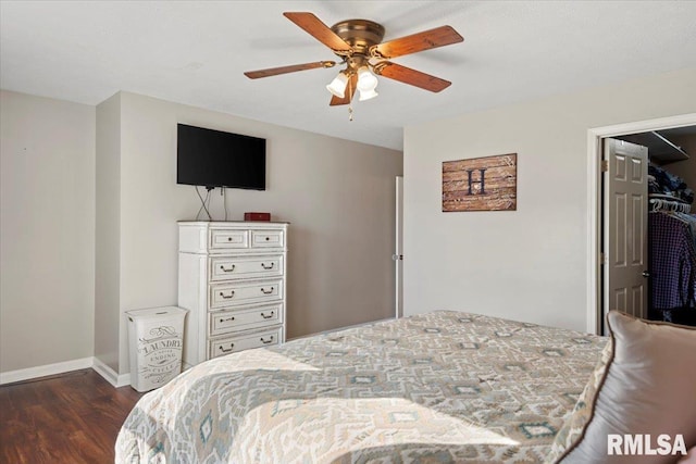 bedroom featuring dark wood-type flooring, baseboards, and ceiling fan