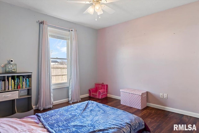 bedroom featuring wood finished floors, baseboards, and ceiling fan