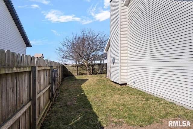 view of yard with a fenced backyard