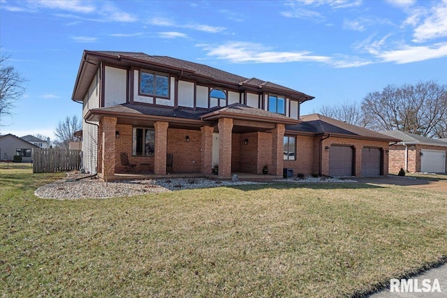 view of front of home featuring a front yard, brick siding, an attached garage, and fence