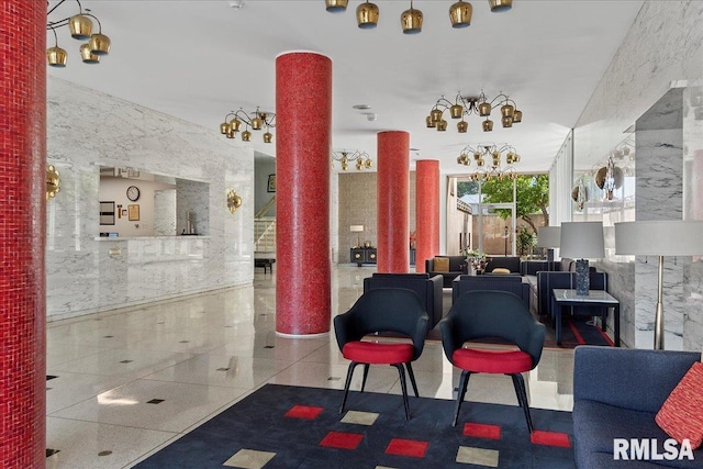 interior space with an inviting chandelier and ornate columns