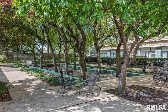 view of swimming pool with a patio area and fence