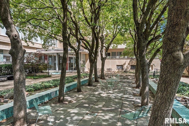 view of home's community with a patio area