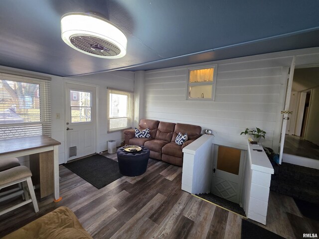 living room featuring visible vents and wood finished floors