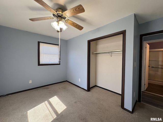 unfurnished bedroom featuring ceiling fan, baseboards, a closet, and light carpet