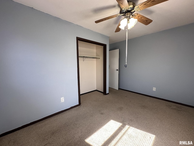 unfurnished bedroom with a closet, baseboards, carpet, and ceiling fan