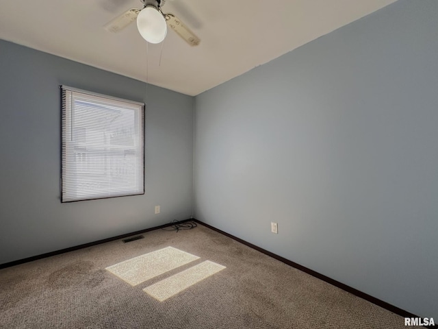 unfurnished room featuring visible vents, ceiling fan, baseboards, and carpet