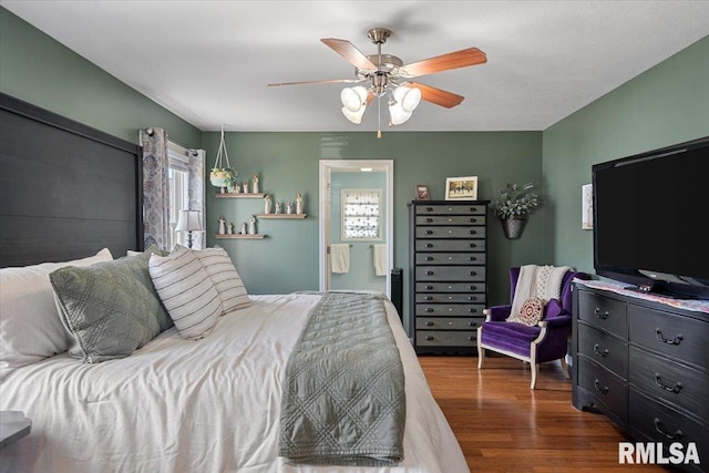 bedroom featuring a ceiling fan and wood finished floors