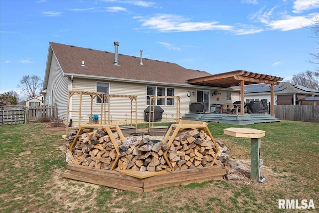 rear view of property with fence, an outdoor fire pit, a deck, and a pergola