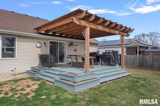 wooden terrace with grilling area, a yard, a pergola, and fence